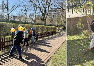 Uczniowie szukają jajeczek w ogrodzie szkolnym.